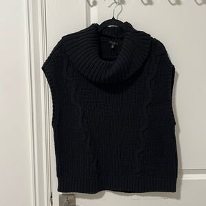 Black sweater vest with removable cowl neck.